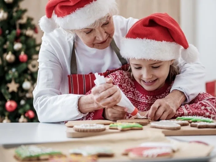 Baking cookies in Santa hats.