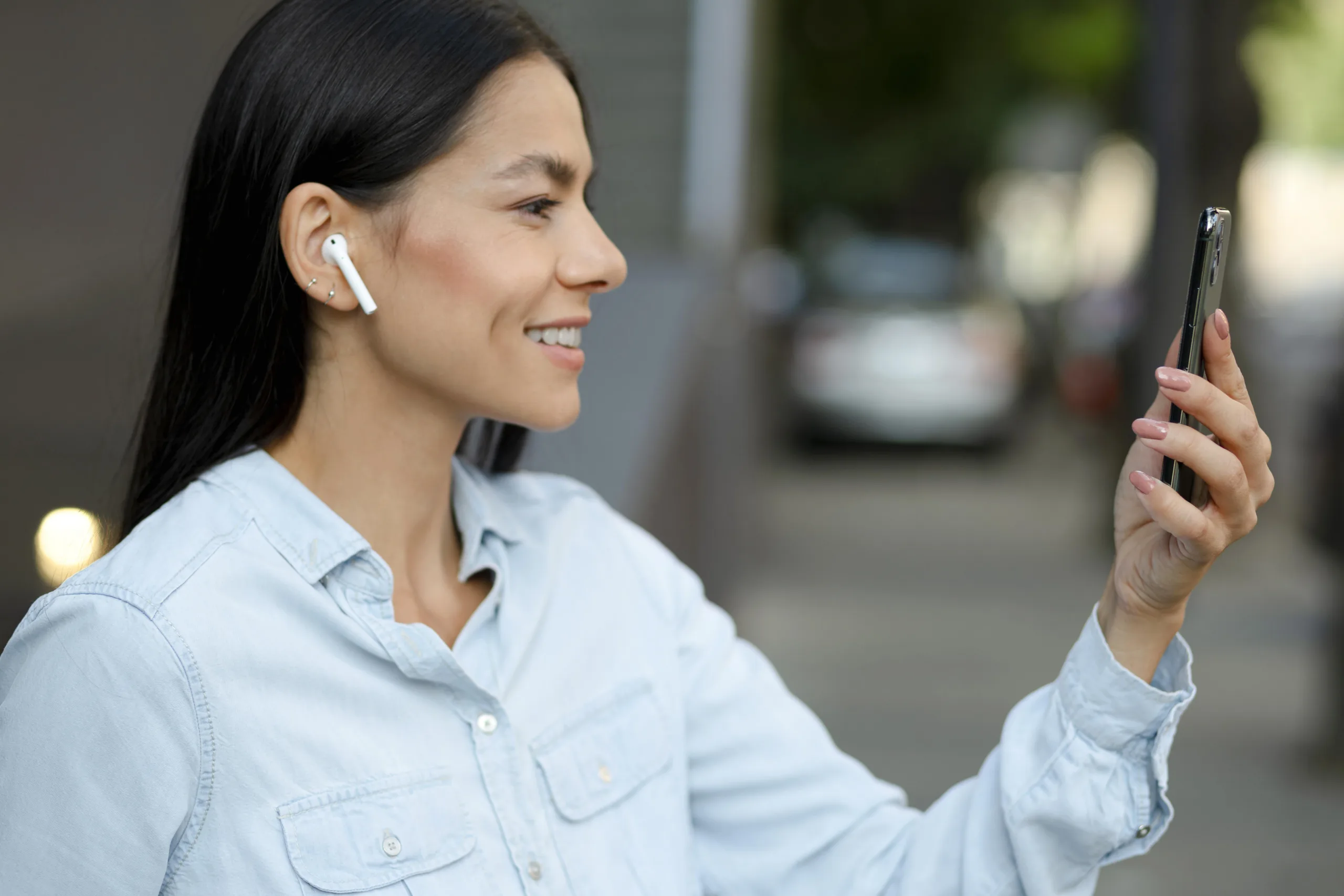 Woman with earphones smiling
