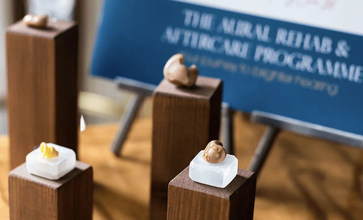 Small sculptures on wooden pedestals.