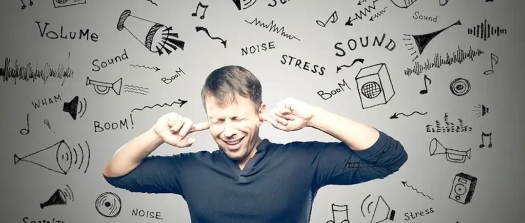 Man with his fingers in his ears