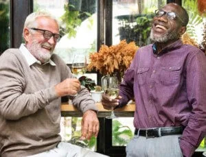 Two gentlemen laughing together