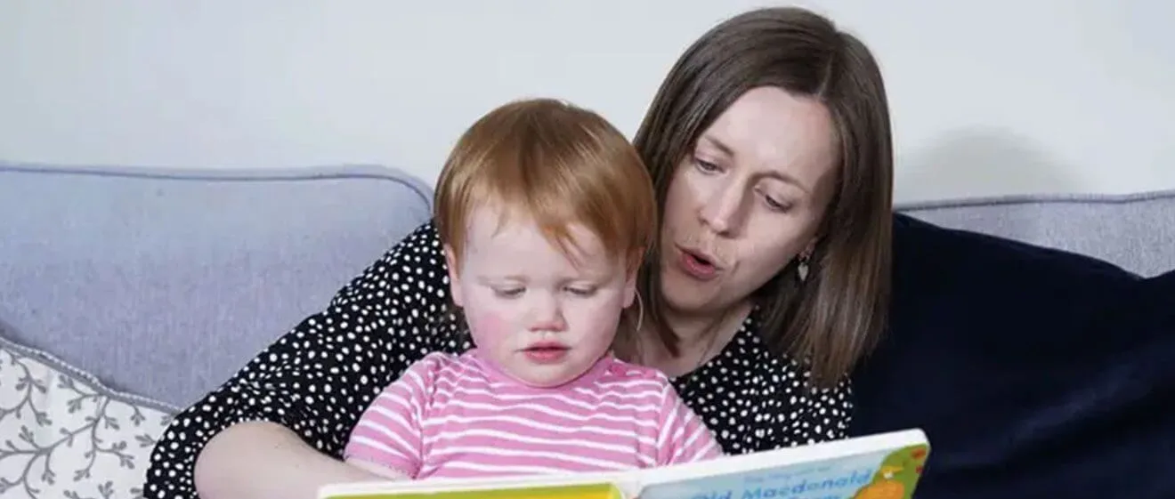 Woman and child reading together.