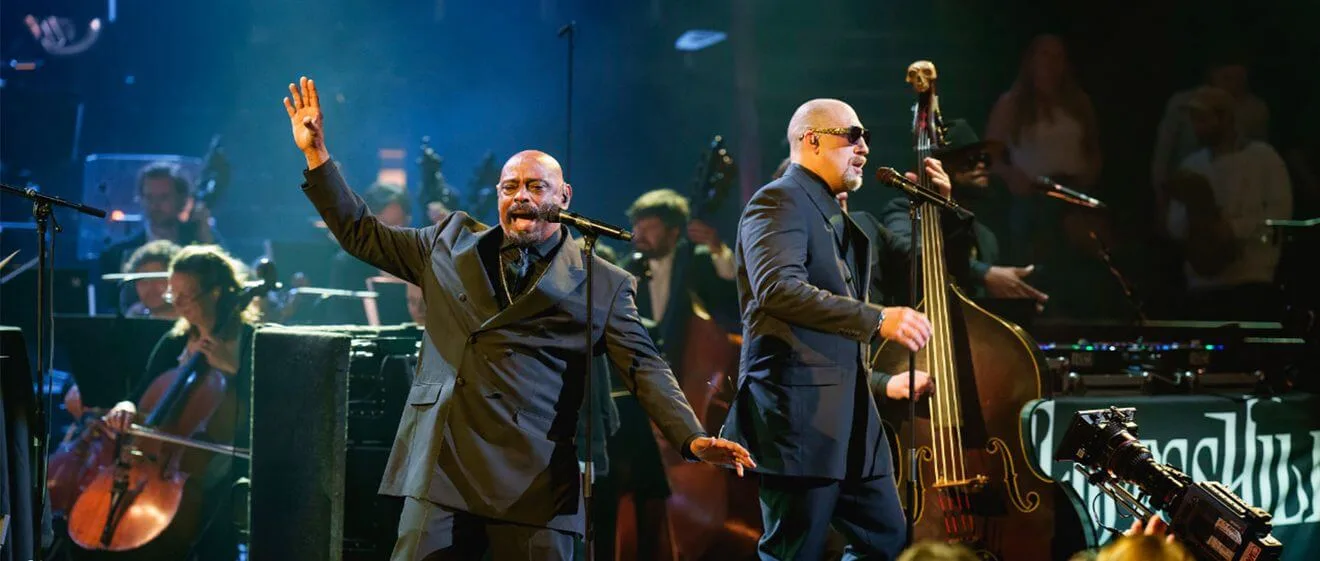 Musicians performing on stage.