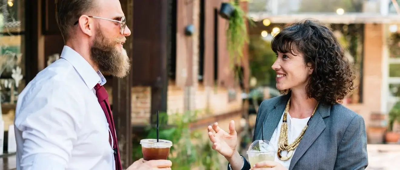 Two people enjoying drinks.