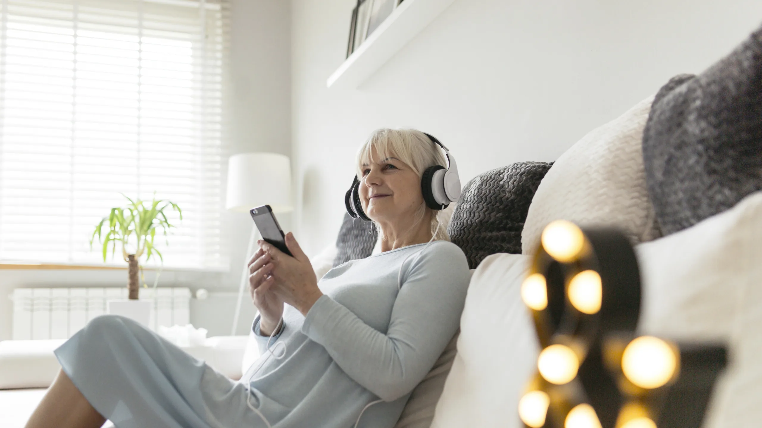 Elderly woman listening music