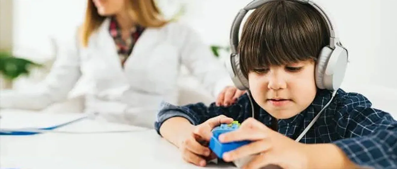 Child wearing headphones playing.