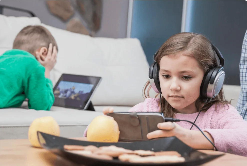 Children using electronic devices.