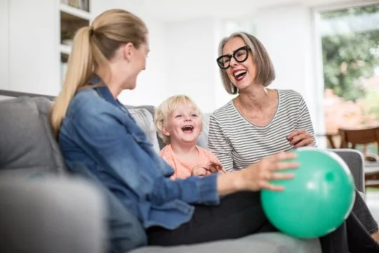 Family laughing with balloon