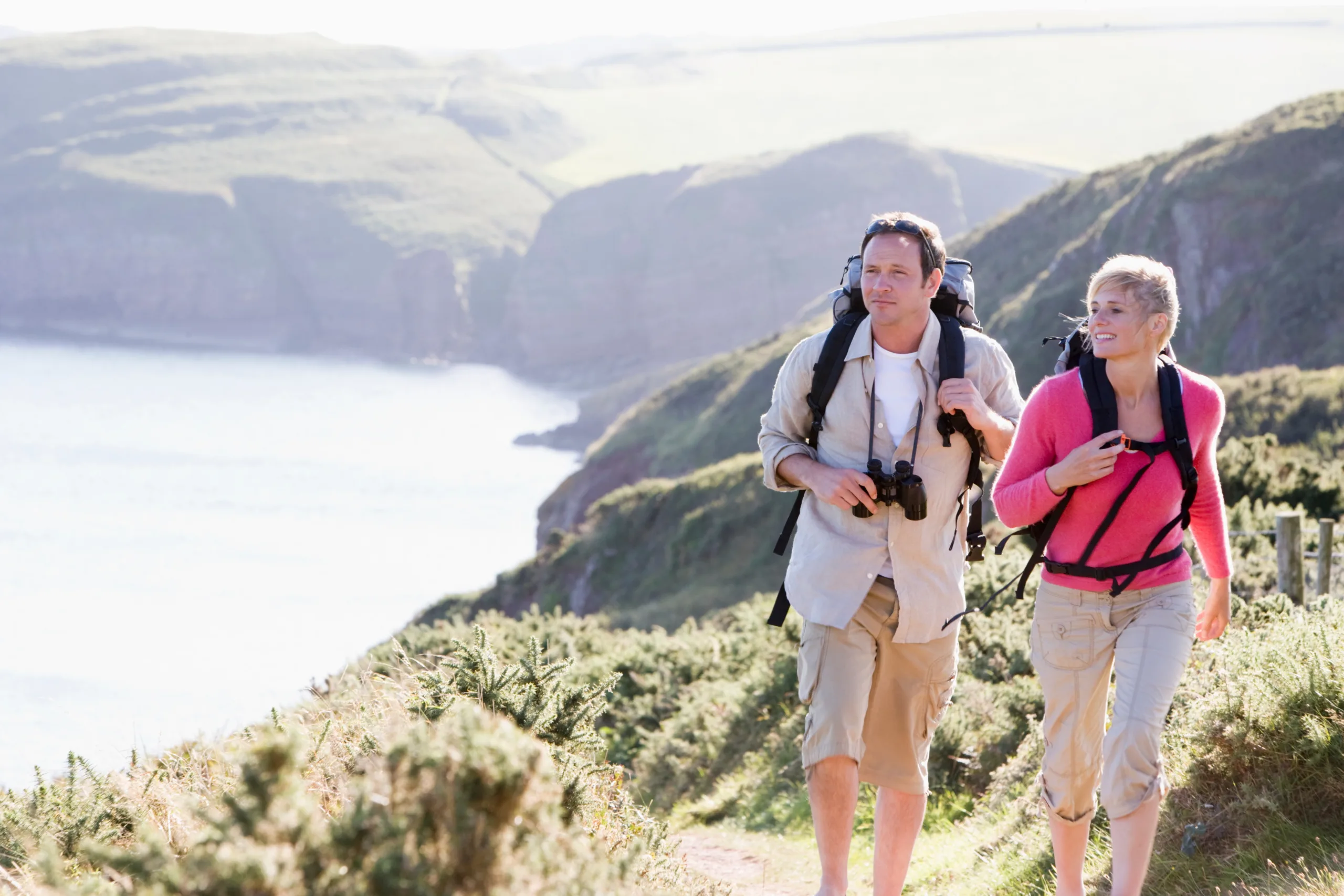 Couple hiking coastal path