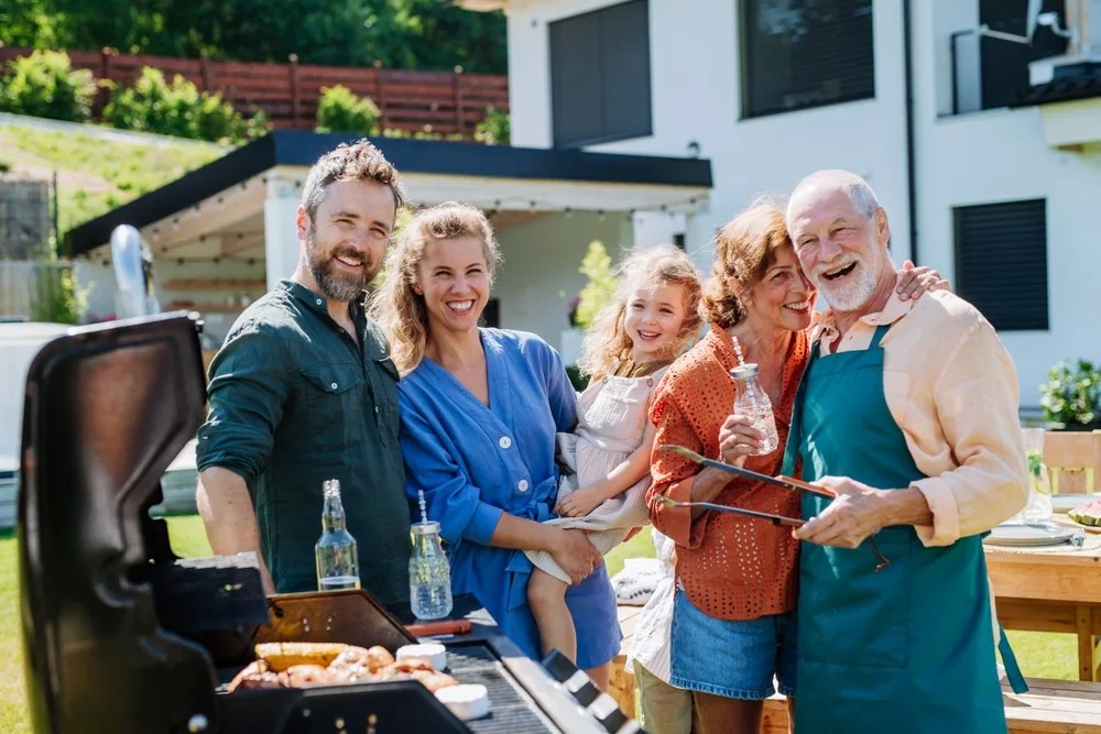 Family barbecue gathering outdoors.
