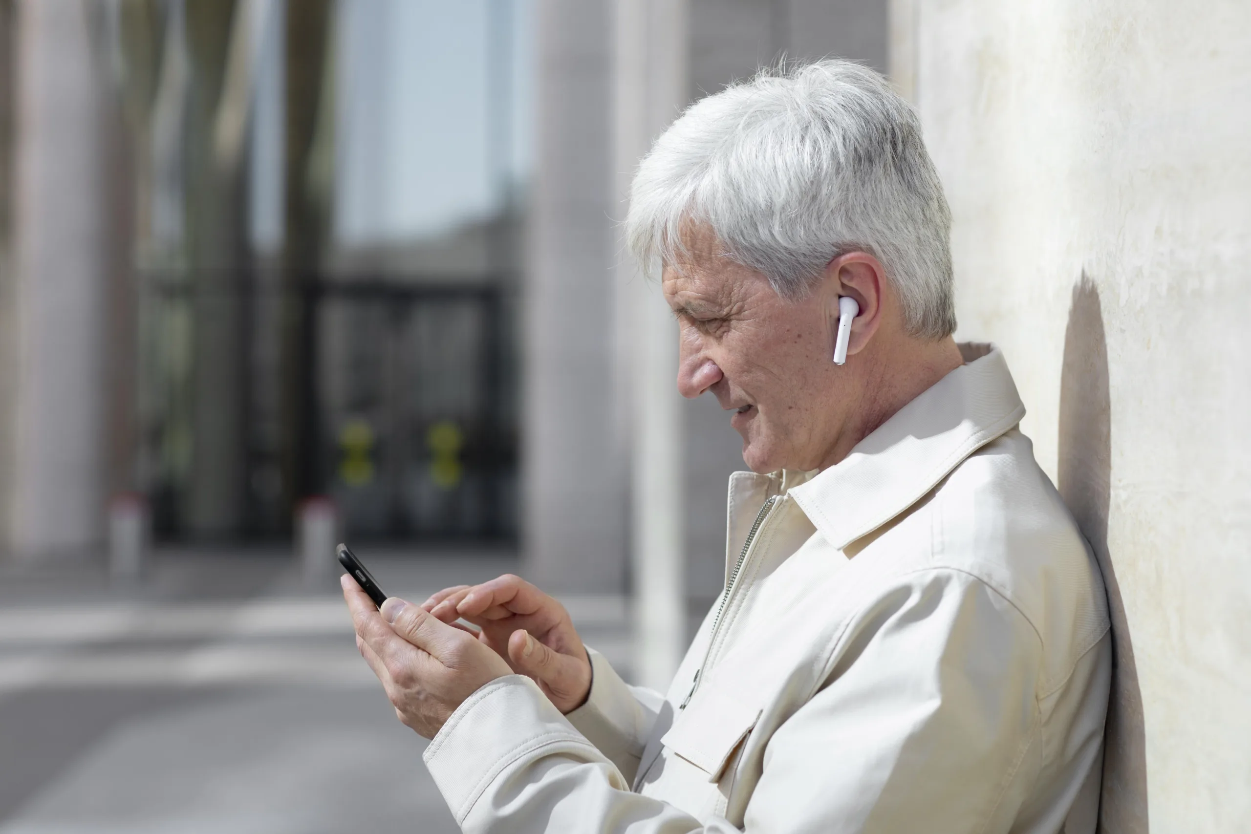 Man using phone outdoors