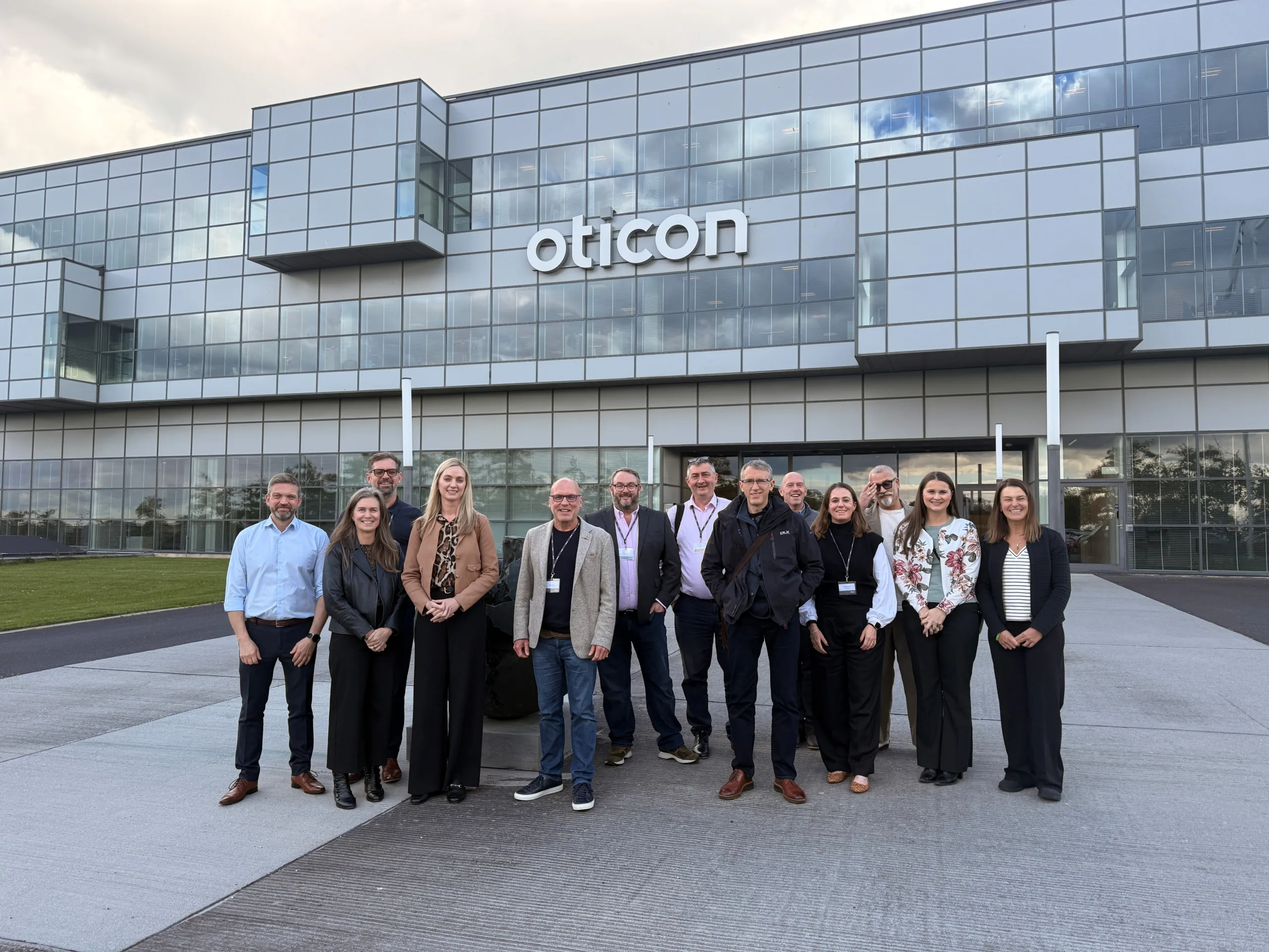 Group in front of building.