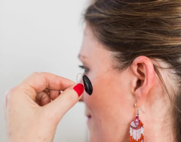 putting-on-hearing-aid-step1