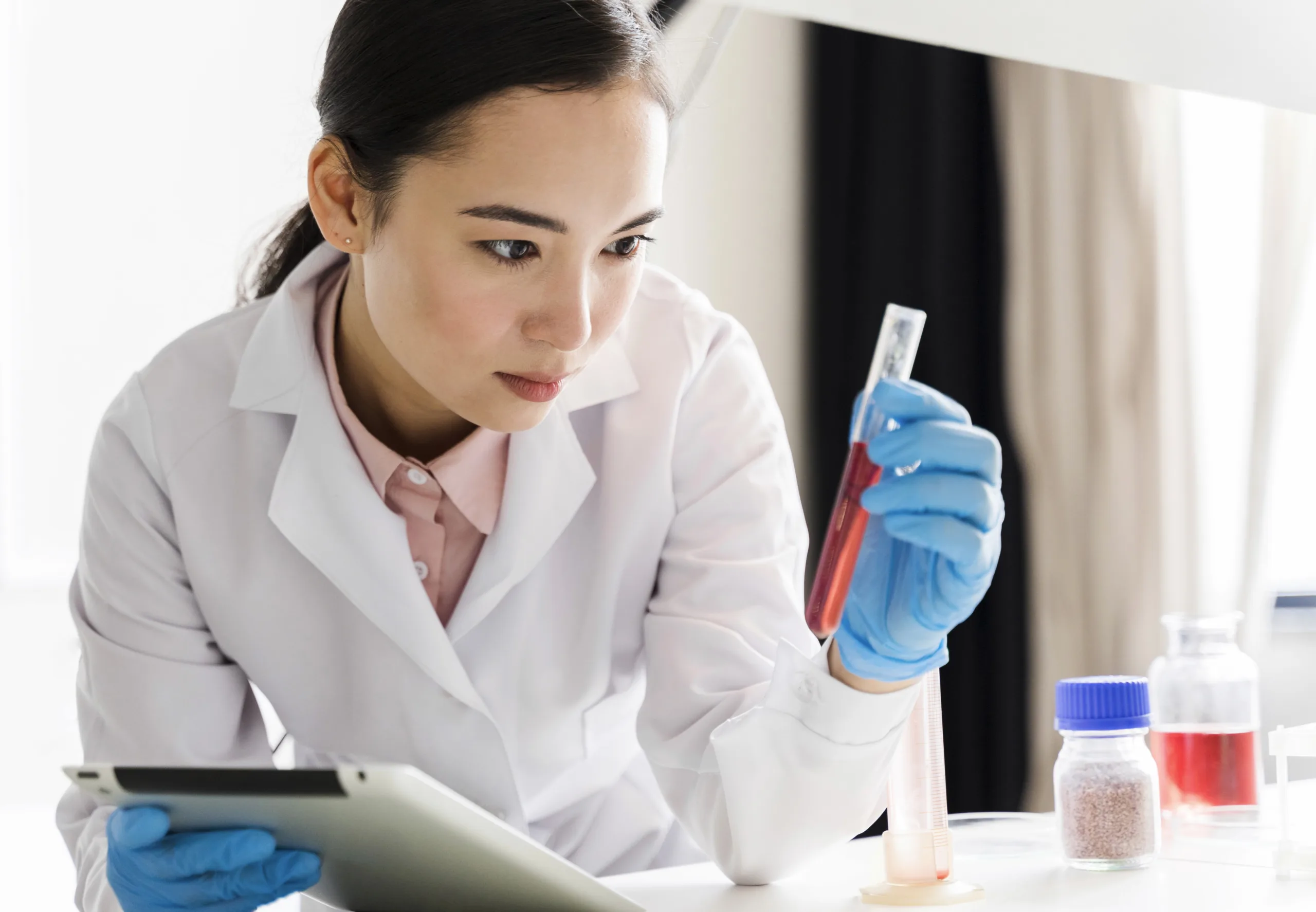 Scientist examining test tube