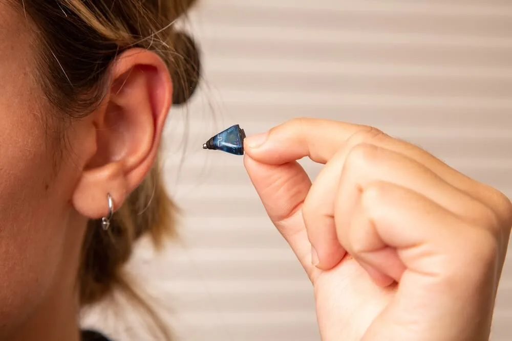 In-ear hearing aid held