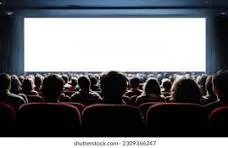 Audience watching movie screen