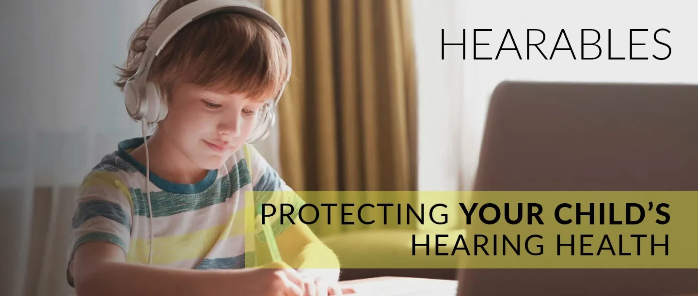 Child wearing headphones studying