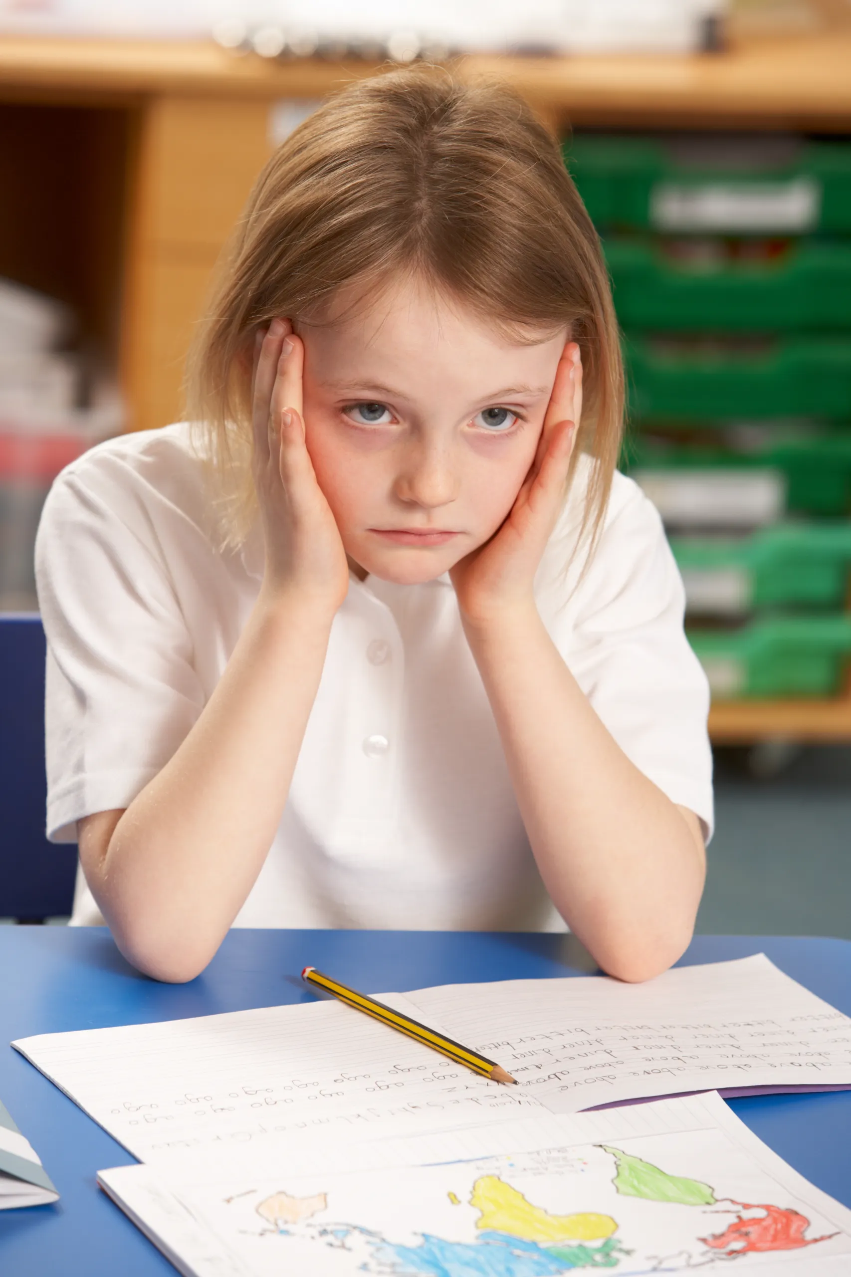 Child bored with homework.