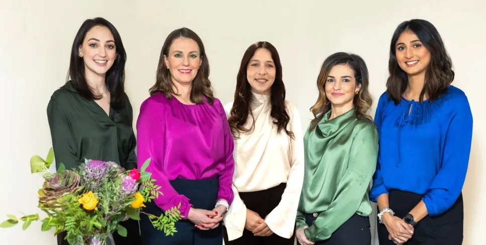 Group of women smiling together.