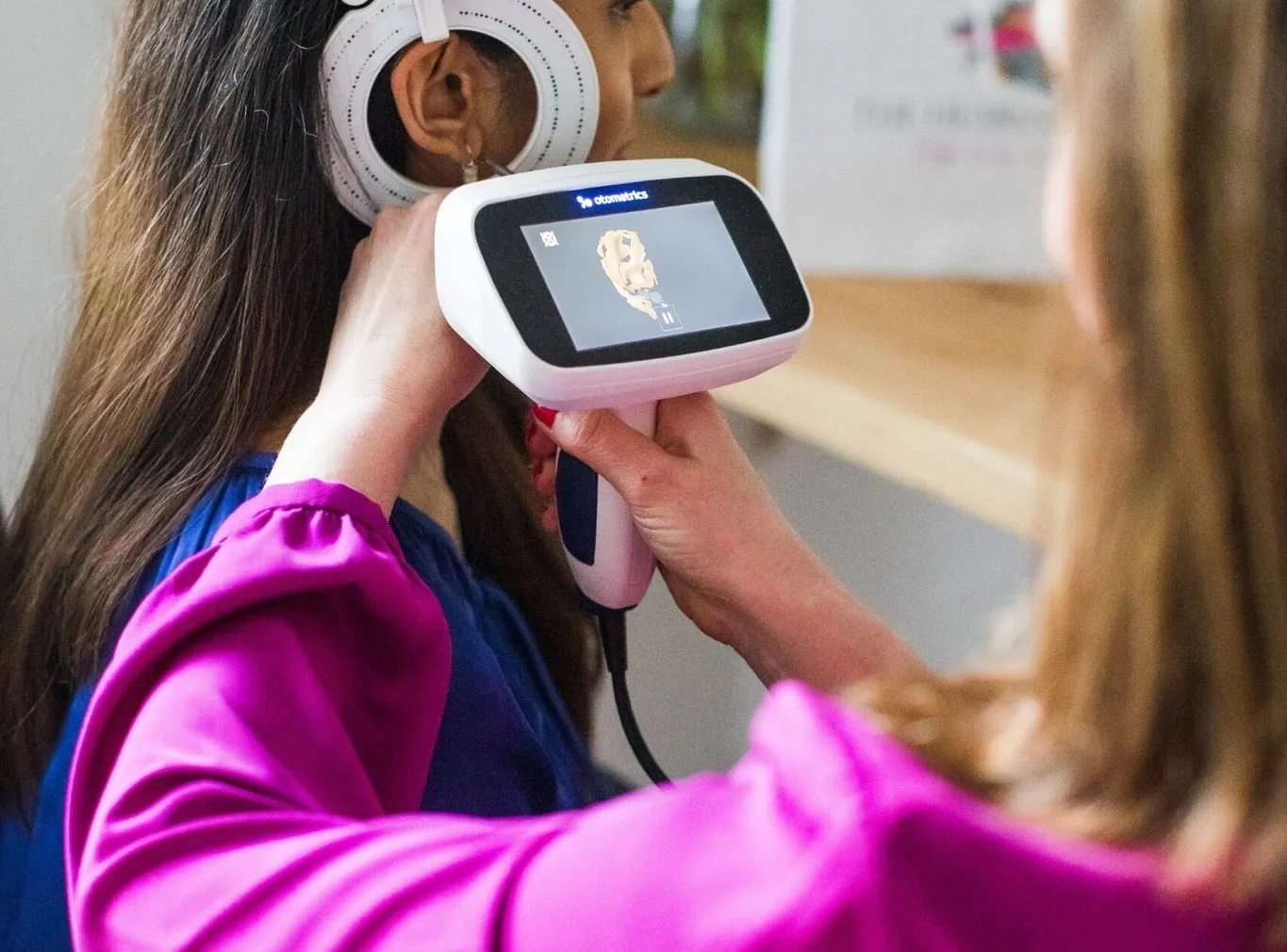 Ear scanning with device.